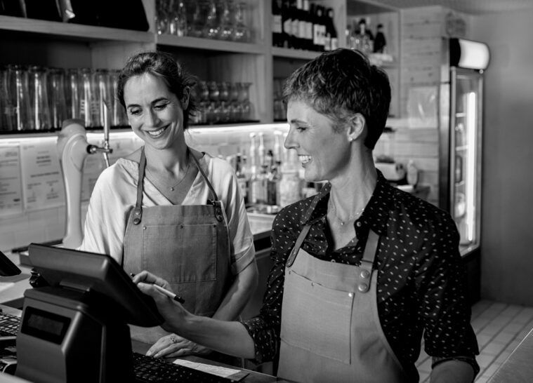 Mature women waitress working at coffee shop